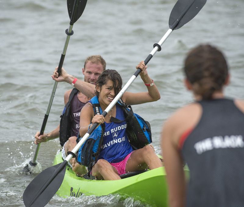 Team Rudder's Paola Rosas and Scott Johnson paddle to a dramatic finish in the kayak race BY DENY HOWETH